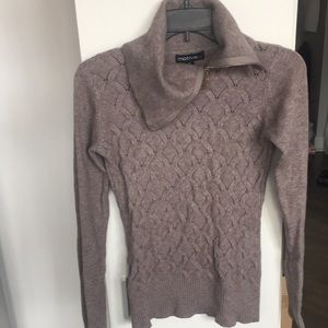 Sweater with zip mock neck.